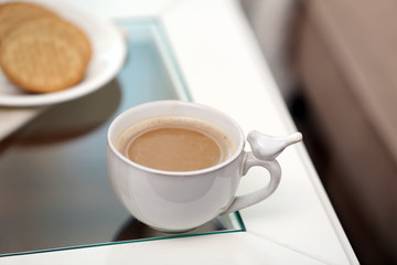 Cup of coffee on table close up