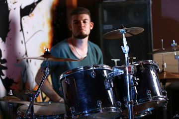 Drummer on dark background