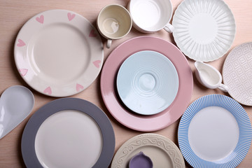 Composition of tableware on rosy background