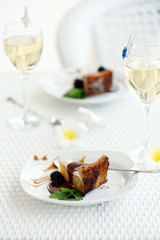 Delicious cake under chocolate glaze with blackberry and mint