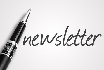 pen writes newsletter on white blank paper