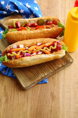Fresh hot dogs on wooden background