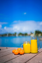 Fresh squizzed orange juice near the ocean