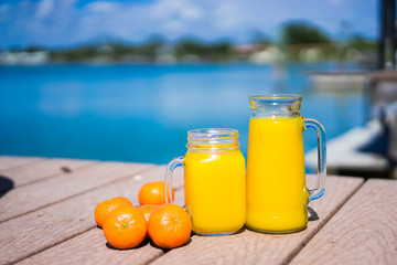 Fresh squizzed orange juice near the ocean