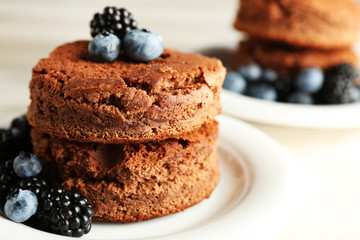 Cakes with berries on the table