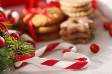 Christmas Candy Canes with Christmas decoration on table close-up