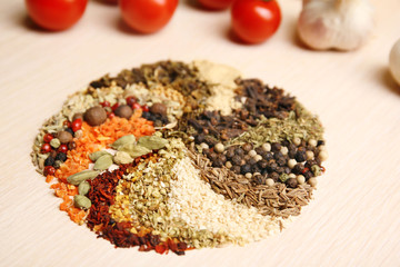 Variety of spices in the shape of a circle on the kitchen table