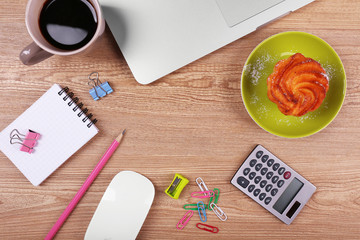 Top view of comfortable working place on wooden background