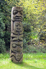 Weathered totem pole in forest