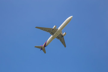 Airplane taking off at sky blue