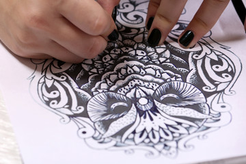 Obraz na płótnie Canvas Process of making a sketch for tattoo close-up
