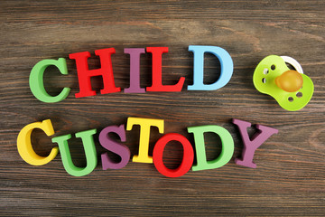 A dummy and colourful letters regarding child-custody and family-law concept