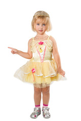 Little girl in a beautiful yellow dress  pointing his finger on
