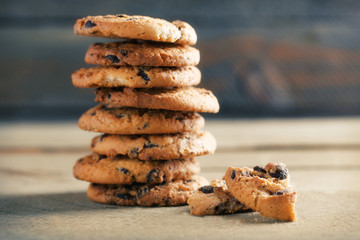 Cookies with chocolate crumbs on wooden table, close up