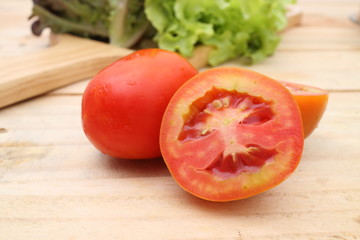 Healthy fresh vegetables salad preparation with kitchen utensils on a table and nutrition concepts