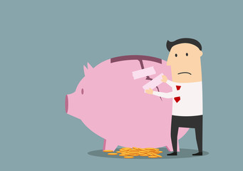 Businessman repairing cracked piggy bank