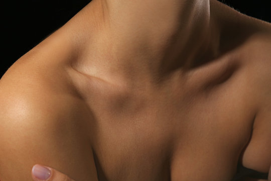 View on woman's neck, collarbone, breast and shoulders, close-up