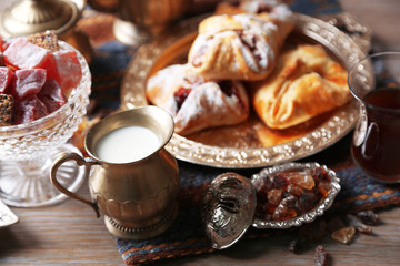 Antique tea-set with Turkish delight and baking on table close-up