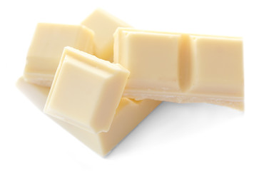 White chocolate pieces isolated on white background