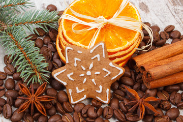 Decorated gingerbread, coffee grains and spices, christmas time