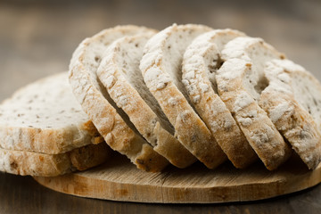 Loaf freshly baked traditional bread on  wooden table