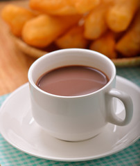 Hot cocoa with deep fried dough stick  for breskfast