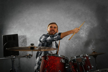 Musician playing the drums in a studio