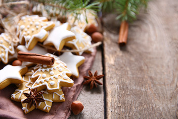 Cookies with spices and Christmas decor, on wooden table
