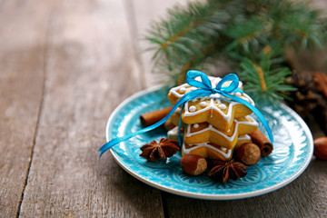 Cookies with spices and Christmas decor, on wooden table