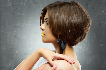 oung beauty model with bob haircut. profile view. beauty face .