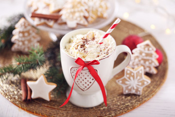 Beautiful composition with cup of cappuccino and Christmas cookies