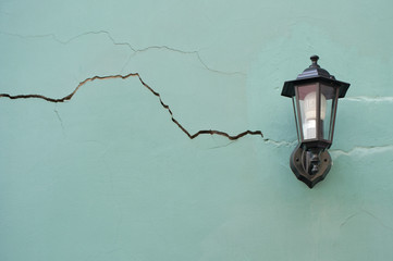 Lantern on the cracked wall..