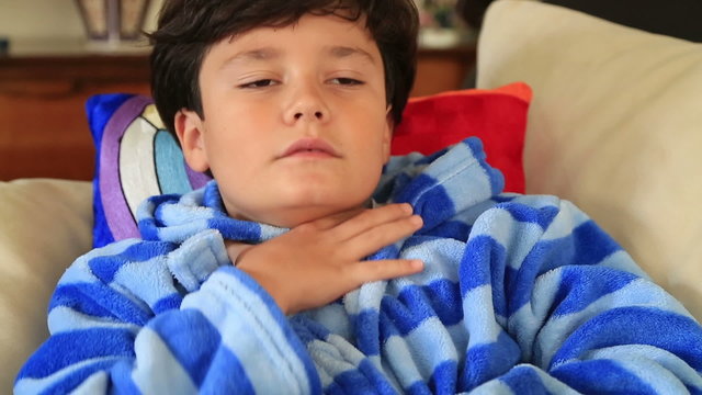 Child using asthma inhaler