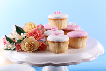 Tasty cupcake on stand, close-up
