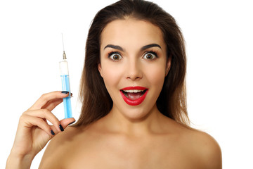 Young emotional woman holding syringe, isolated on white