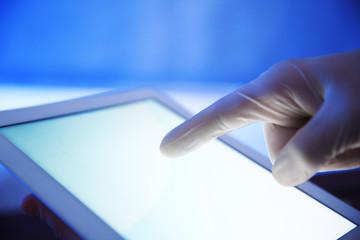 Doctor working with tablet-pc, close up