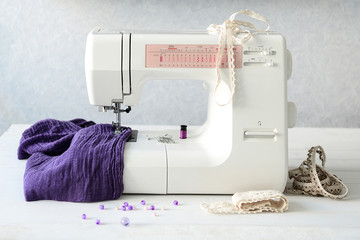 sewing machine with fabric and threads 