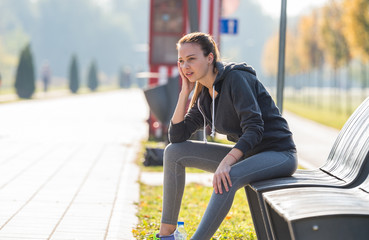 Girl sitting on a park bench