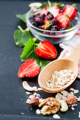 Breakfast - oatmeal with honey and berries, blue bowl