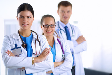 Portrait of a smiling medical team standing with their hands crossed