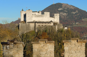 Salzburg fortress Hohensalzburg in Austria and castle wall. Castle in front of Gaisberg mountain on the right and the Nockstein on the left. Festival city for classical music,  birthplace of Mozart.