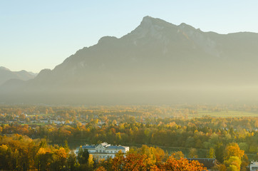 Mystic magic Untersberg in Salzburg Austria in a special autumn mood with flat november sun showing a foggy atmosphere. The mountain featured at the beginning and end of the movie The Sound of Music.