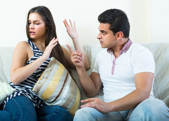 Quarrel between young spouses at home.