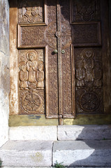 Wooden door a cross with carved patterns in the church Berd Dzor
