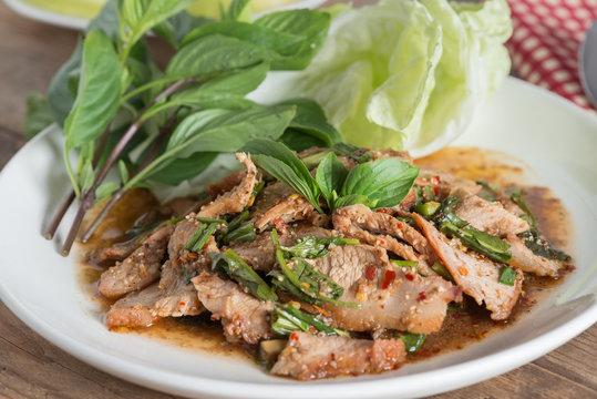 Sliced grilled pork spicy salad, Moo Nam Tok. Thai cuisine.
