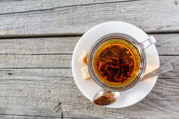 Black tea in glass cup, top view