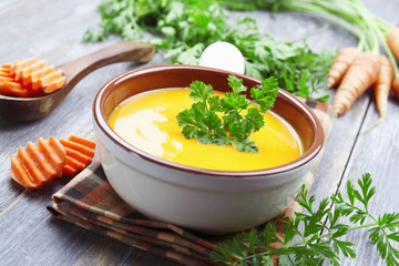 Carrots soup in the ceramic pot
