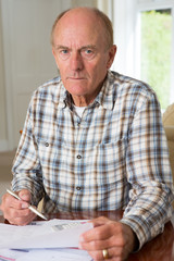 Concerned Senior Man Reviewing Domestic Finances
