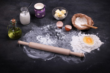 various ingredients for the dishes are laid out on a black background