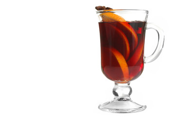 Cup with mulled wine and lemon slices and cinnamon with anise lying next to the bowl of honey on wooden table, on lights background